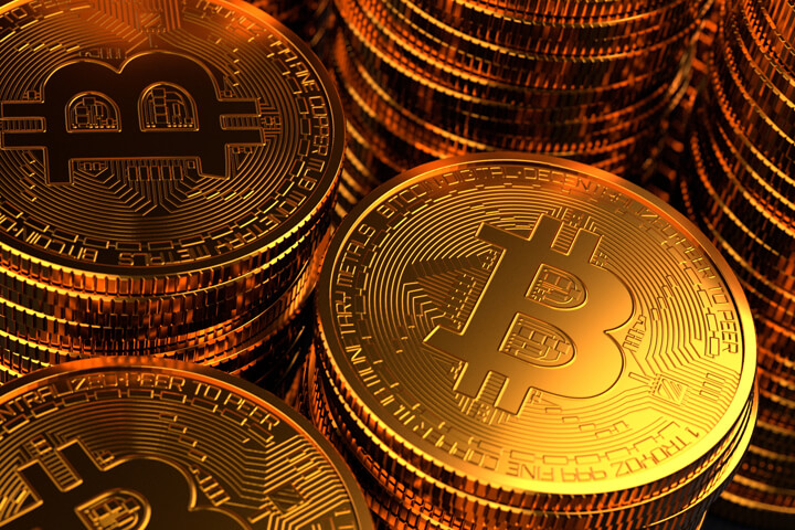 Close-up photo of stacks of Bitcoins with dynamic lighting