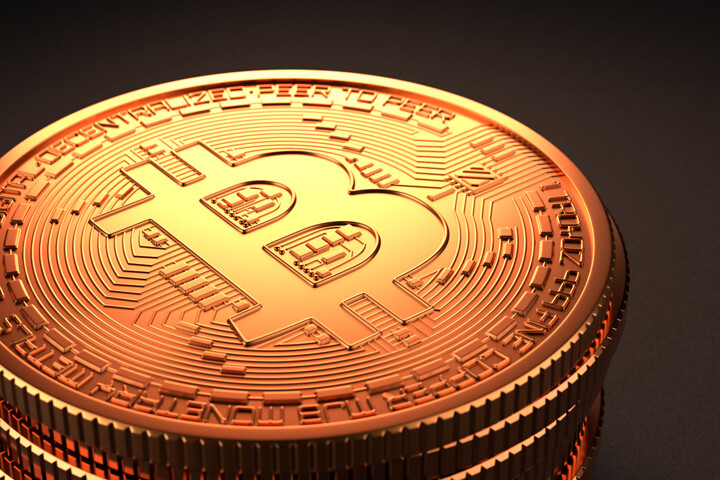 Alternate camera position on stack of Bitcoins with dark background