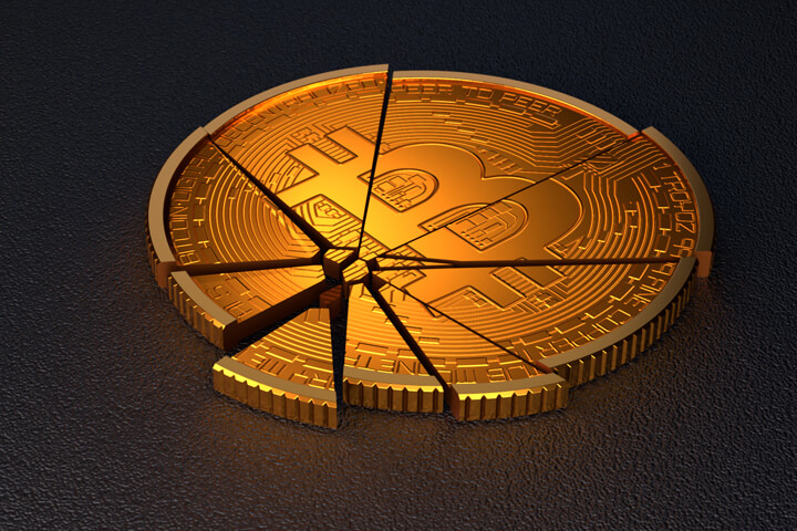 Broken Bitcoin concept for falling prices, cryptocurrency market crash, or price volatility