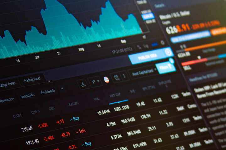 Laptop screen showing BTC Bitcoin stock price information