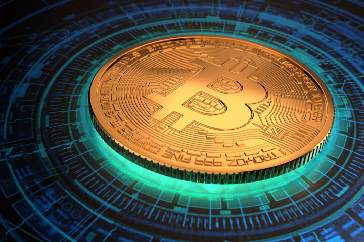 Gold Bitcoin with light emitting from below with circular digital blockchain pattern on background