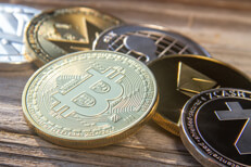 Bitcoin in front of row including Zcash, Ethereum, Ripple, Monero, and Litecoin