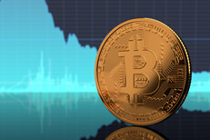 Bitcoin standing on edge on reflective surface with blue BTC stock price area chart in background