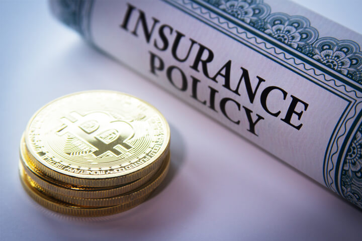 Insurance policy next to stack of Bitcoins concept for Bitcoin insurance