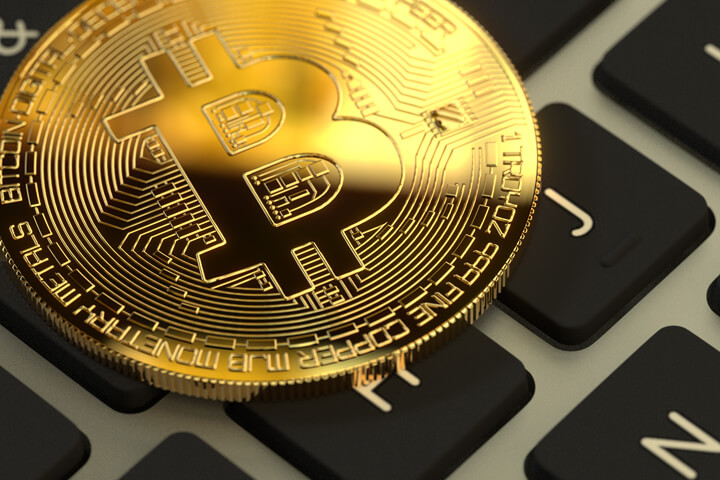 Bitcoin on Apple MacBook keyboard