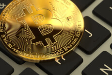 Bitcoin on Apple MacBook keyboard