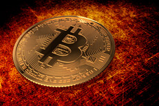 Bitcoin on grunge background lit in orange and red