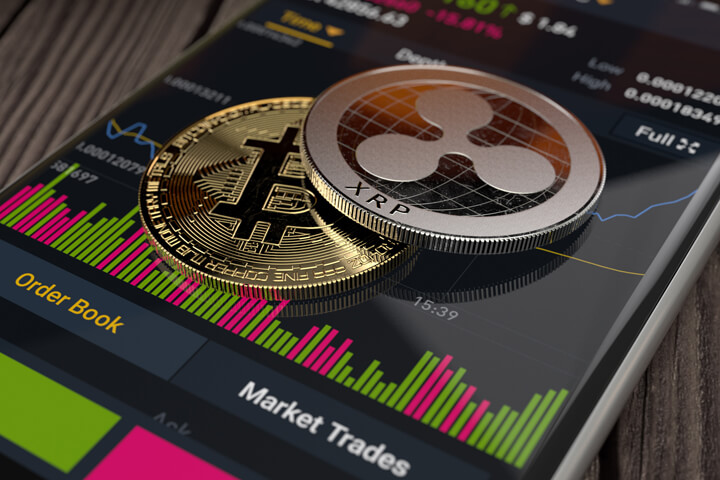 Ripple XRP and Bitcoin on an iPhone screen showing Binance app trading info