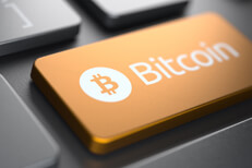 Laptop keyboard with bronze metallic Bitcoin key