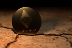 Ethereum crypto coin stuck in cracked earth in desert