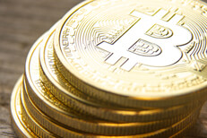 Close up view from top of leaning stack of bitcoins