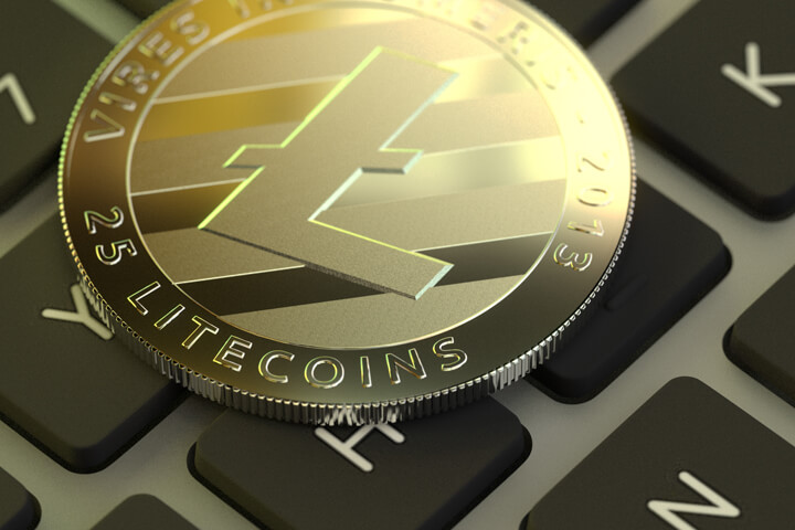 Free photo of Litecoin cryptocurrency token on laptop keyboard