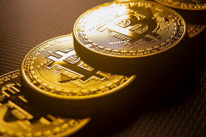 Bitcoins stacked in order with window light in background