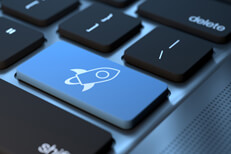 Laptop keyboard with blue Stellar cryptocurrency key