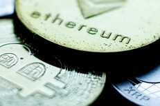 Tarnished Ethereum, Bitcoin, and XRP coins close up photo showing sharp contrast and metal tarnish