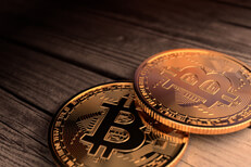 Two Bitcoins close up photo laid on old weathered wood planks