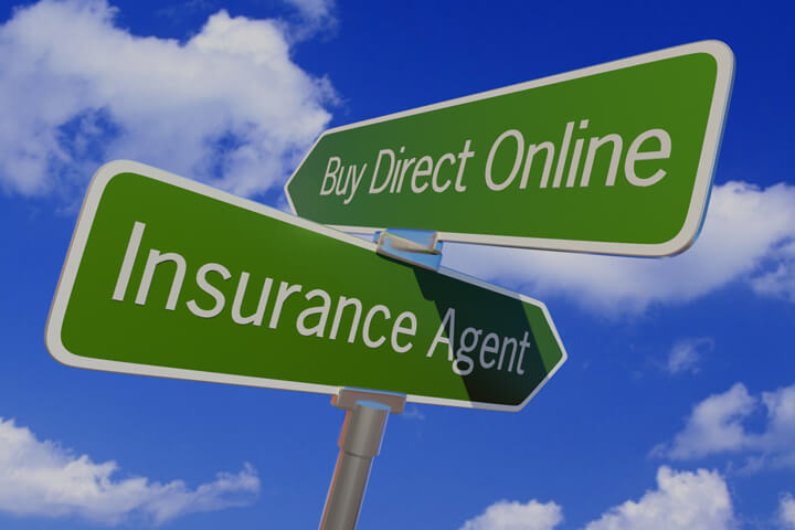 Street sign with opposite arrows pointing to Buy Direct Online or Insurance Agent