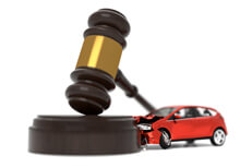 Car crashed into judge gavel concept photo for auto insurance liability