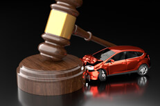 Small car crashed into gavel with dark reflective background