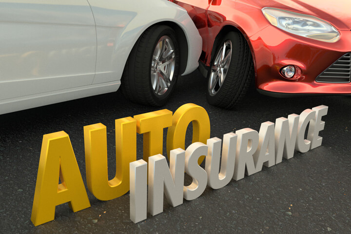 Two car collision with words auto insurance spelled in front