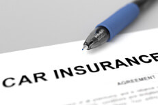 Car insurance policy close up image with ink pen