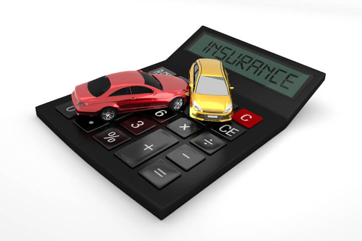 Car accident on calculator with LCD showing insurance isolated on white background