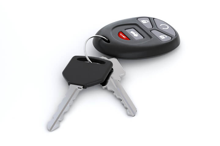 Car keys and key fob isolated on white