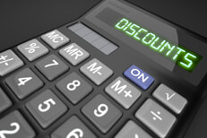 Calculator showing LCD word Discounts on dark background