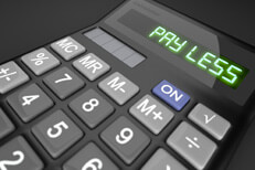 Calculator on dark background with LCD reading Pay Less