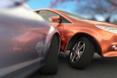 Two car accident outside showing damage to wheel and body