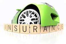 Green sport car bumper fish eye view over wood insurance letters