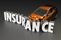 Car insurance concept of car crashed into insurance word on dark background