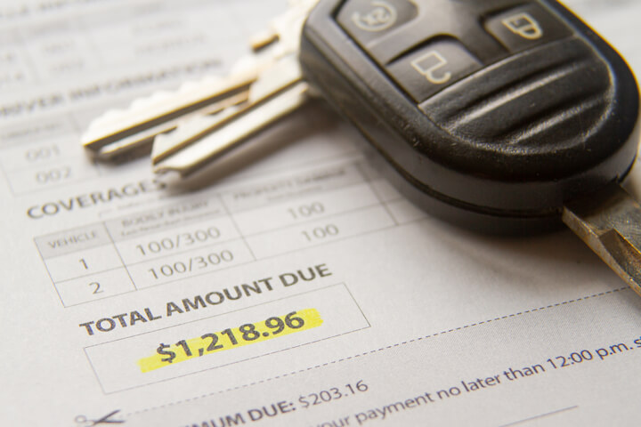 Auto insurance bill showing amount due with car keys
