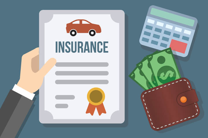 Hand holding auto insurance policy with cash sticking out from wallet and calculator concept for the cost of auto insurance