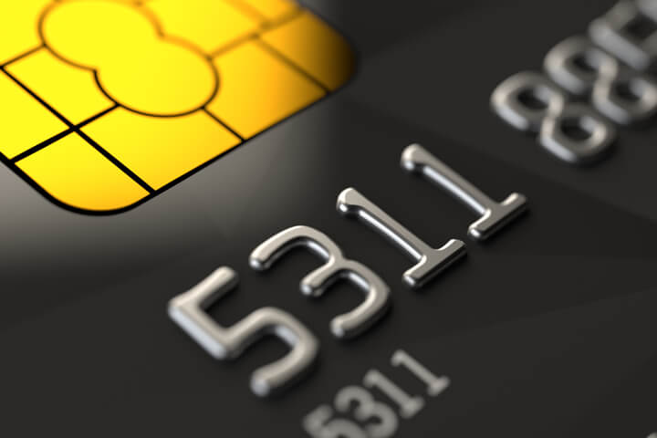Close up photo of black credit card with focus on credit card chip