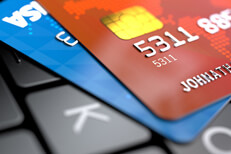 Credit cards on keyboard Two credit cards on laptop keyboard with focus blur