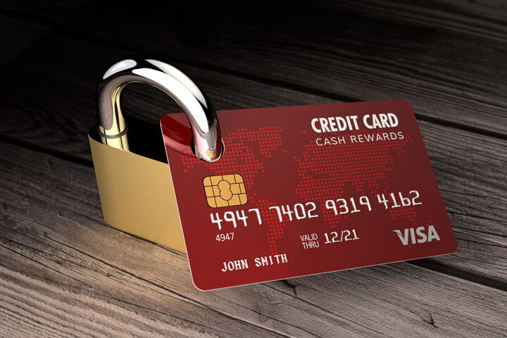 Photo of credit card with padlock locked through hole punched through card