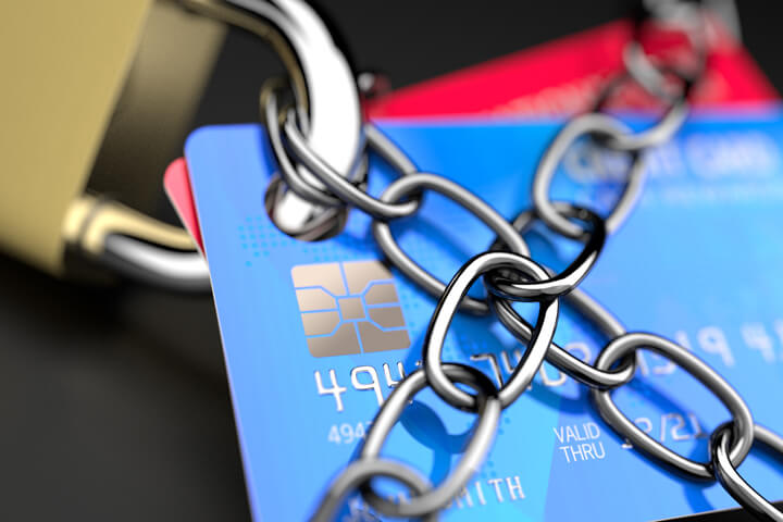 Credit cards locked to padlock and wrapped in chains concept for credit protection