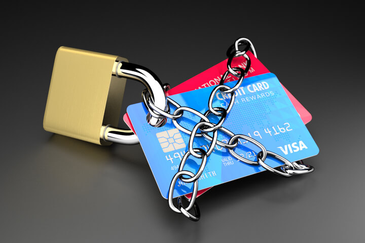Two credit cards padlocked and chained concept for credit lock or secure credit
