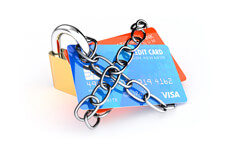 Credit cards with padlock and chains isolated on white
