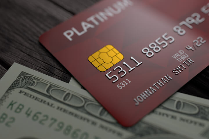 Credit card on cash with subtle lighting