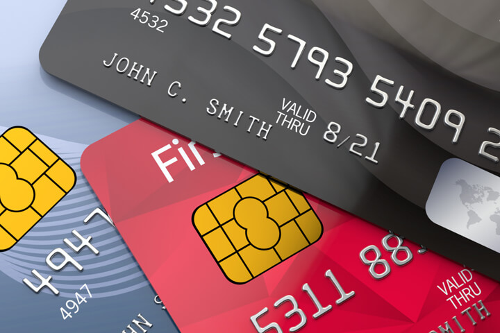 Top view photo of three credit cards with EMV chips