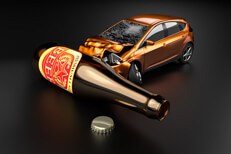 Orange car crashed into beer bottle laying on side concept for drunk driving or DUI with dark background