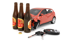 Car crashed into three beer bottles with car keys on ground concept for DUI or drunk driving