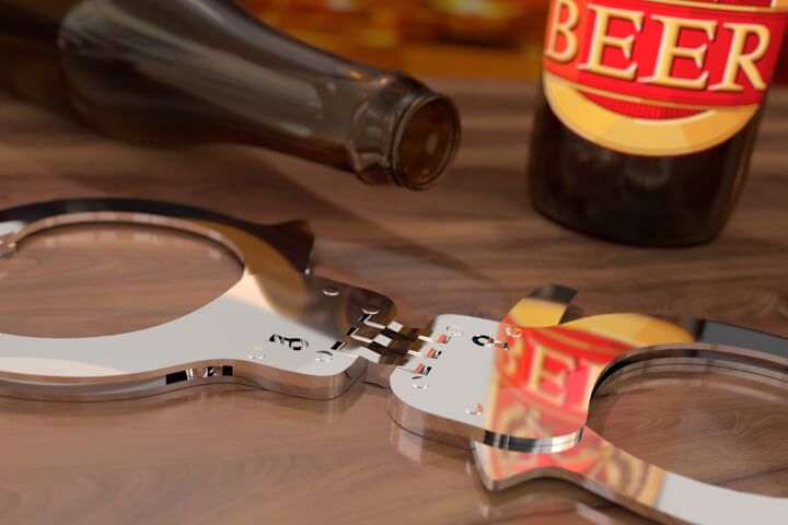 Beer bottles on bar with hand cuffs concept for DUI or drunk driving arrest