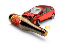 Car crashed into beer bottle laying on white background DUI concept