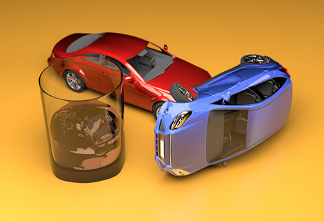 Car accident next to glass of whiskey from drunk driving stylized with gold colored studio background