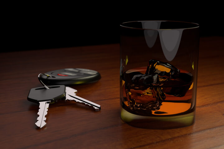 Drunk driving concept white car keys and drink on bar