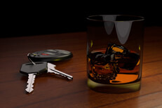 Drunk driving concept white car keys and drink on bar