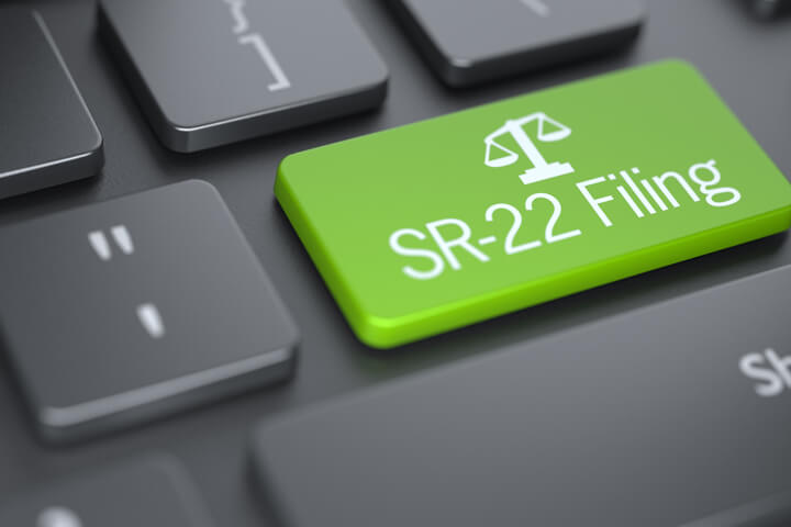 Dark keyboard with large green SR-22 Filing key concept for finding SR-22 car insurance online